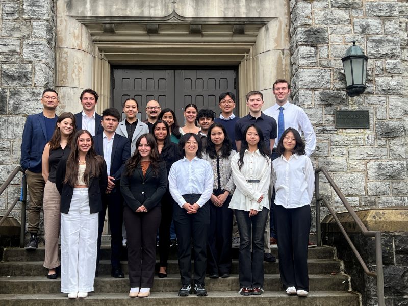 group of people standing in front of Hutcheson Hall